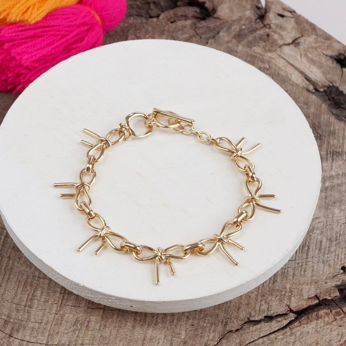 #396 Bow Link Bracelet Gold Tone
