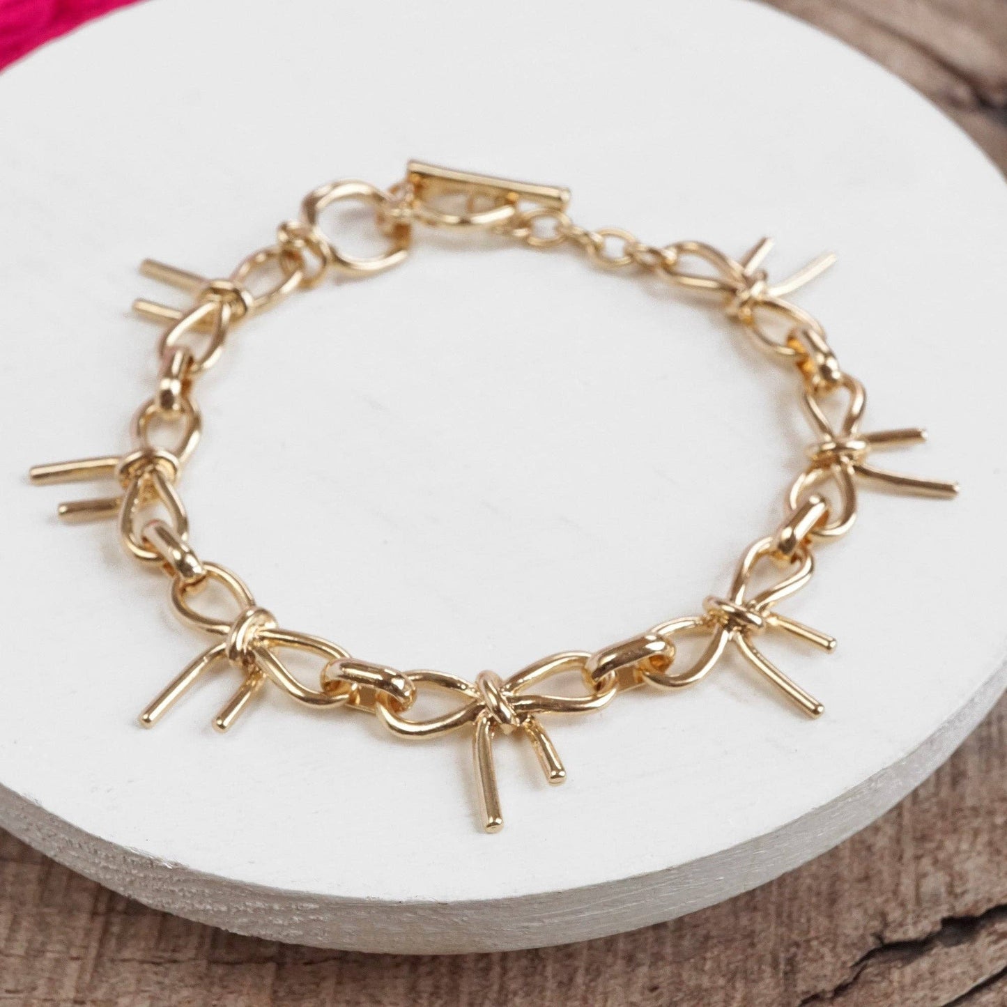 #396 Bow Link Bracelet Gold Tone
